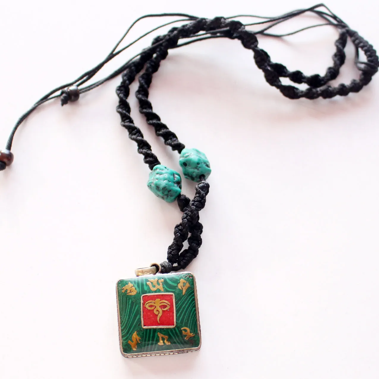 Coral Inlaid White Metal Square Buddha Eye Pendant