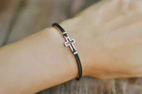 Women bracelet with silver outline cross charm, black cord